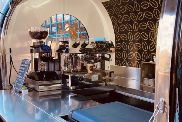 Coffee machine and grinder inside coffee trailer